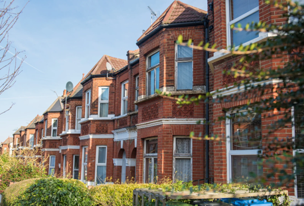 Residential houses representing how is council tax calculated based on property value and local authority rates.