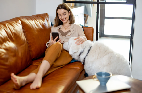 Person using a smartphone at home representing council app usage and mobile-first user behaviour.
